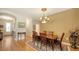 Formal dining room with hardwood floors, chandelier, and wooden table at 5552 Eagle Creek Rd, Sarasota, FL 34238