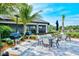 Outdoor grilling area with multiple grills and seating at 5552 Eagle Creek Rd, Sarasota, FL 34238