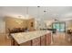 Island kitchen with granite countertops and hardwood floors at 5552 Eagle Creek Rd, Sarasota, FL 34238