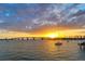 Scenic sunset over the water with bridge and sailboat at 5552 Eagle Creek Rd, Sarasota, FL 34238