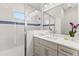 Modern bathroom with quartz countertop and shower at 5902 Red Mangrove Ln, Bradenton, FL 34210