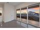 Bedroom with sliding doors and sunset view at 5902 Red Mangrove Ln, Bradenton, FL 34210