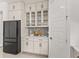 Well-organized pantry with glass-front cabinets and ample shelving at 5902 Red Mangrove Ln, Bradenton, FL 34210