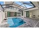 Enjoy this relaxing pool area, complete with a covered patio and spacious deck at 5902 Red Mangrove Ln, Bradenton, FL 34210