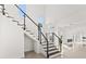 Modern staircase with glass and metal accents at 5902 Red Mangrove Ln, Bradenton, FL 34210