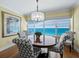 Ocean view dining room with round table and four patterned chairs at 603 Longboat Club Rd # 1102N, Longboat Key, FL 34228