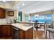 Kitchen features a breakfast bar overlooking the dining area at 603 Longboat Club Rd # 1102N, Longboat Key, FL 34228