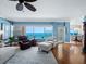 Living area features hardwood floors, comfortable seating, and stunning ocean views at 603 Longboat Club Rd # 1102N, Longboat Key, FL 34228