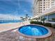 Relaxing pool and spa area with ocean views at 603 Longboat Club Rd # 1102N, Longboat Key, FL 34228