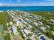 Aerial view of waterfront homes and canal at 605 Jungle Queen Way, Longboat Key, FL 34228