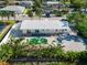 Aerial view showing home, pool, and backyard at 605 Jungle Queen Way, Longboat Key, FL 34228