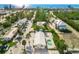 Aerial image of a house with a pool near the beach at 605 Jungle Queen Way, Longboat Key, FL 34228