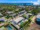 Aerial view of a house with a pool, near the beach at 605 Jungle Queen Way, Longboat Key, FL 34228