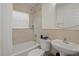 Clean bathroom with a shower/tub combo, toilet and vanity at 605 Jungle Queen Way, Longboat Key, FL 34228