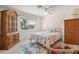 Bedroom with coastal decor and a large wooden armoire at 605 Jungle Queen Way, Longboat Key, FL 34228