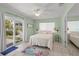 Bright bedroom with sliding door access to the backyard at 605 Jungle Queen Way, Longboat Key, FL 34228