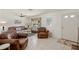 Living room with leather furniture and tile floors at 605 Jungle Queen Way, Longboat Key, FL 34228