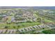 Aerial view showing community, golf course, and lake at 6085 Clubside Dr # 7682, Sarasota, FL 34243