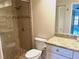 Bathroom with shower, toilet and granite vanity at 6085 Clubside Dr # 7682, Sarasota, FL 34243