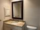 Bathroom with granite countertop, single sink, and a large mirror at 6085 Clubside Dr # 7682, Sarasota, FL 34243