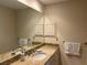 Bathroom with granite countertop, double sinks, and ample storage at 6085 Clubside Dr # 7682, Sarasota, FL 34243