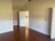 Bright bedroom with hardwood floors and access to other rooms at 6085 Clubside Dr # 7682, Sarasota, FL 34243