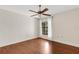 Bedroom with wood floors, window and ceiling fan at 6085 Clubside Dr # 7682, Sarasota, FL 34243