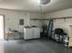 Garage with storage shelves, a water heater, and laundry hookups at 6085 Clubside Dr # 7682, Sarasota, FL 34243