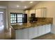 Modern kitchen with granite countertops and stainless steel appliances at 6085 Clubside Dr # 7682, Sarasota, FL 34243