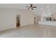 Open living room with kitchen views, tile floors, and high ceilings at 6085 Clubside Dr # 7682, Sarasota, FL 34243