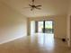 Spacious living room with tile floors and access to a relaxing outdoor area at 6085 Clubside Dr # 7682, Sarasota, FL 34243