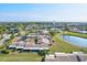 Community overview showcasing buildings, pond, and landscaping at 6131 Heritage Ln # 6131, Bradenton, FL 34209