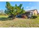 Landscaped backyard with lush greenery and large tree at 6131 Heritage Ln # 6131, Bradenton, FL 34209