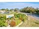 Gated community entrance with lush landscaping and signage at 6131 Heritage Ln # 6131, Bradenton, FL 34209