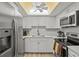 Modern kitchen featuring stainless steel appliances and white cabinets at 6131 Heritage Ln # 6131, Bradenton, FL 34209