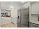 Kitchen boasts stainless steel fridge and white cabinetry at 6131 Heritage Ln # 6131, Bradenton, FL 34209