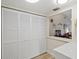 White louvered laundry closet with ample storage space at 6131 Heritage Ln # 6131, Bradenton, FL 34209