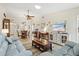 Open living space with sectional sofa, large TV, and dining area view at 6131 Heritage Ln # 6131, Bradenton, FL 34209