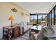 Bright sunroom with comfortable seating and tranquil views at 6131 Heritage Ln # 6131, Bradenton, FL 34209