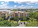 Condos overlooking a tranquil lake, showcasing resort-style living at 6310 Watercrest Way # 201, Lakewood Ranch, FL 34202