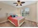 Cozy bedroom with a queen bed and large window at 6310 Watercrest Way # 201, Lakewood Ranch, FL 34202