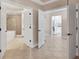 Bright hallway with views into bathroom and kitchen at 6310 Watercrest Way # 201, Lakewood Ranch, FL 34202