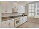 Spacious kitchen, boasting white cabinets and granite countertops at 6310 Watercrest Way # 201, Lakewood Ranch, FL 34202