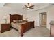 Spacious main bedroom with a king-size bed and ceiling fan at 6310 Watercrest Way # 201, Lakewood Ranch, FL 34202