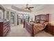 Large main bedroom with wood furniture and water view at 6310 Watercrest Way # 201, Lakewood Ranch, FL 34202