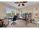 Bright home office with built-in bookshelves at 6310 Watercrest Way # 201, Lakewood Ranch, FL 34202