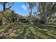 Serene backyard oasis with lush landscaping at 662 Fernwalk Ln, Osprey, FL 34229