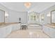 Luxurious bathroom with soaking tub, double vanity, and chandelier at 662 Fernwalk Ln, Osprey, FL 34229