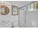 Bright bathroom with shower and updated fixtures at 662 Fernwalk Ln, Osprey, FL 34229