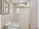 Small bathroom with shower/tub combo and window at 662 Fernwalk Ln, Osprey, FL 34229